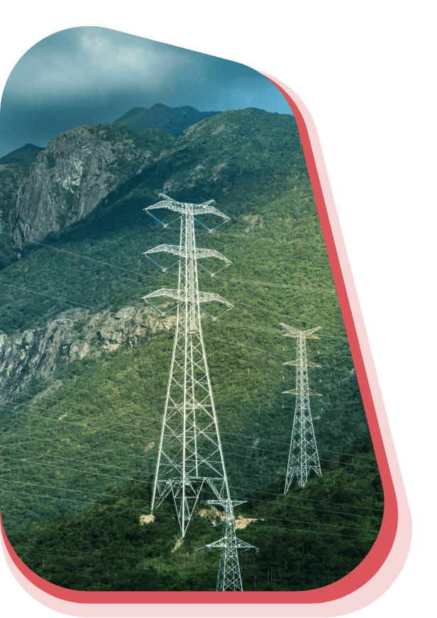Wind turbines in a field against cloudy sky
